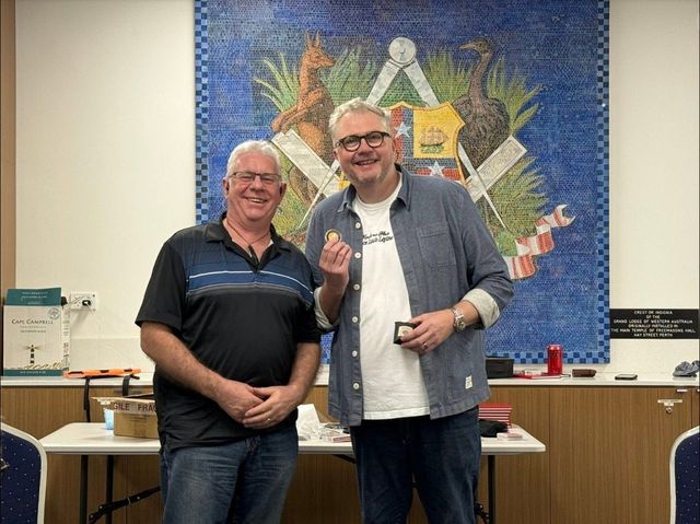 Lecturer Chris Congreave with a WASM member in front of the Grand Lodge mosaic