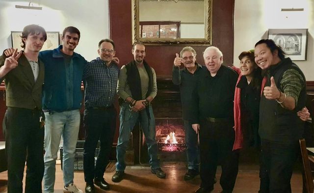 The new 2026 committee at its first meeting by the Le Roi fireplace, early June 2026 (Western Wand caption)