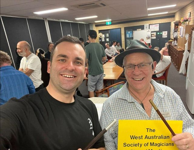 Andrew Gill and Vince Haines, each holding a wand, at the 2024 AGM (tagged "with Vince Haines")